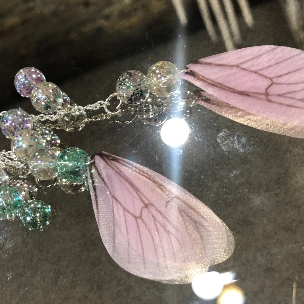 Dangly butterfly pink wings and bead earrings